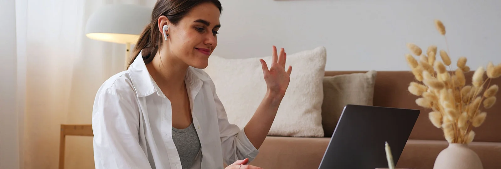 Image of a woman in front of a laptop
